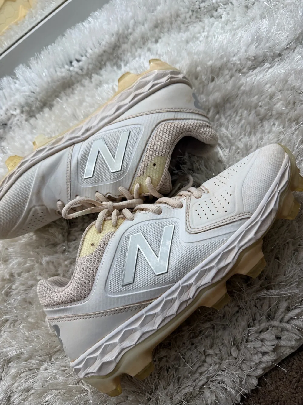 New Balance womens White and Beige Cleats